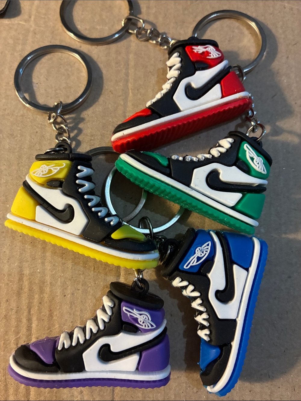 7️⃣ Nike Mini Sneaker Keychain Pick your color!
